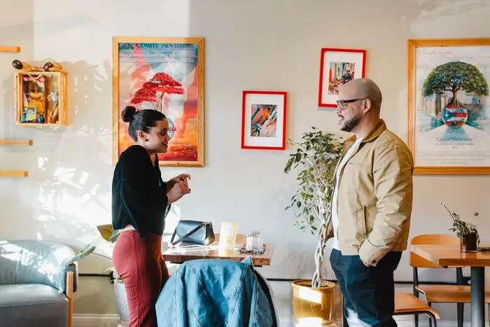 Two Colado Latino Network guests in conversation at Bodega and Vino in Baltimore